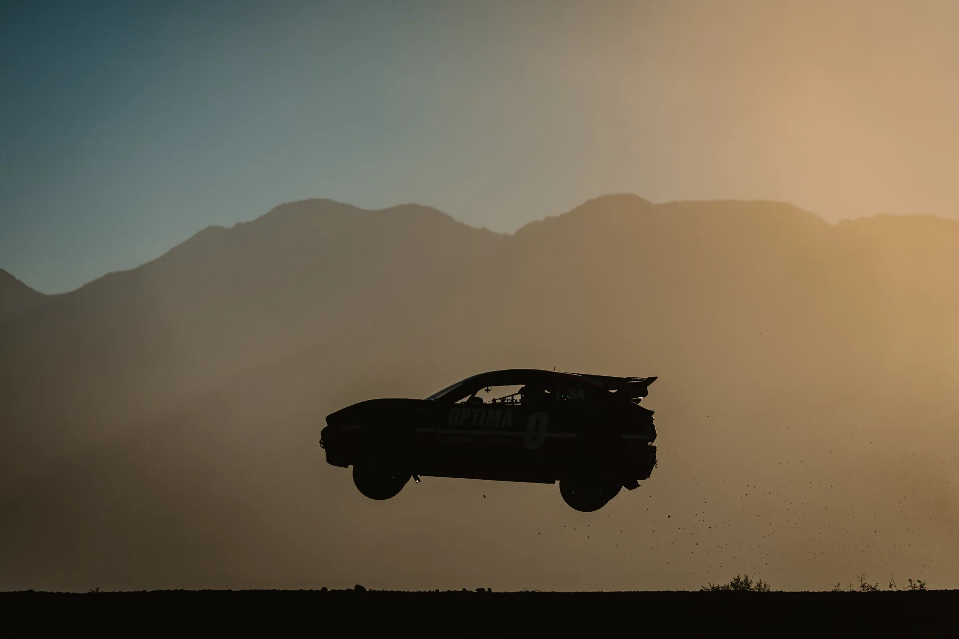 Video portfolio cover - Nitrocross rallycross car silhouetted mid-air against a sunset sky